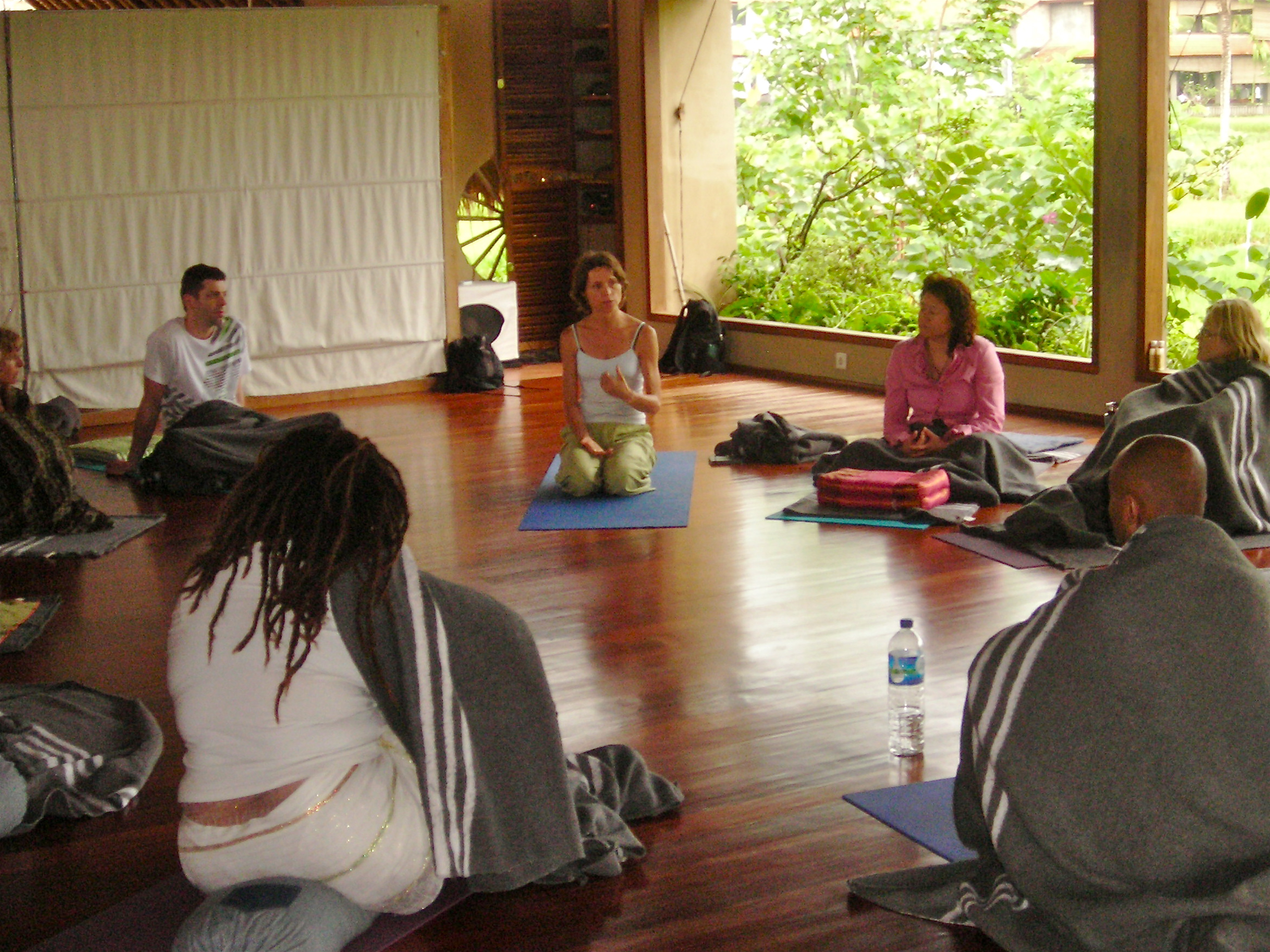 Luiza Kirk teaching a yoga class.